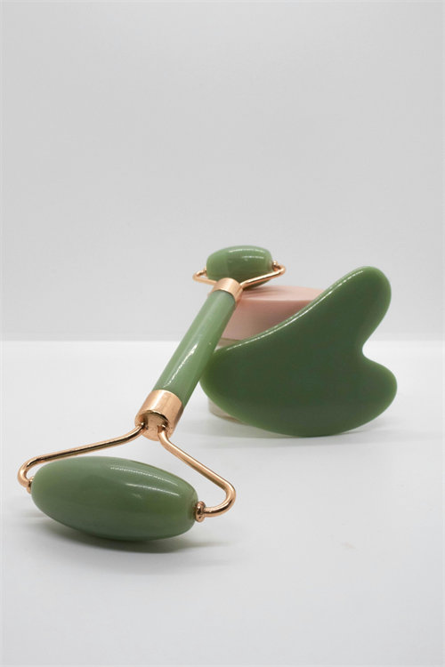 Jade roller for men facial massage tool on male skincare setup