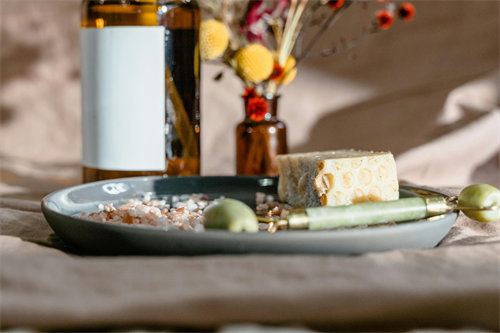 Jade roller being removed from refrigerator showing condensation for chilled skincare routine
