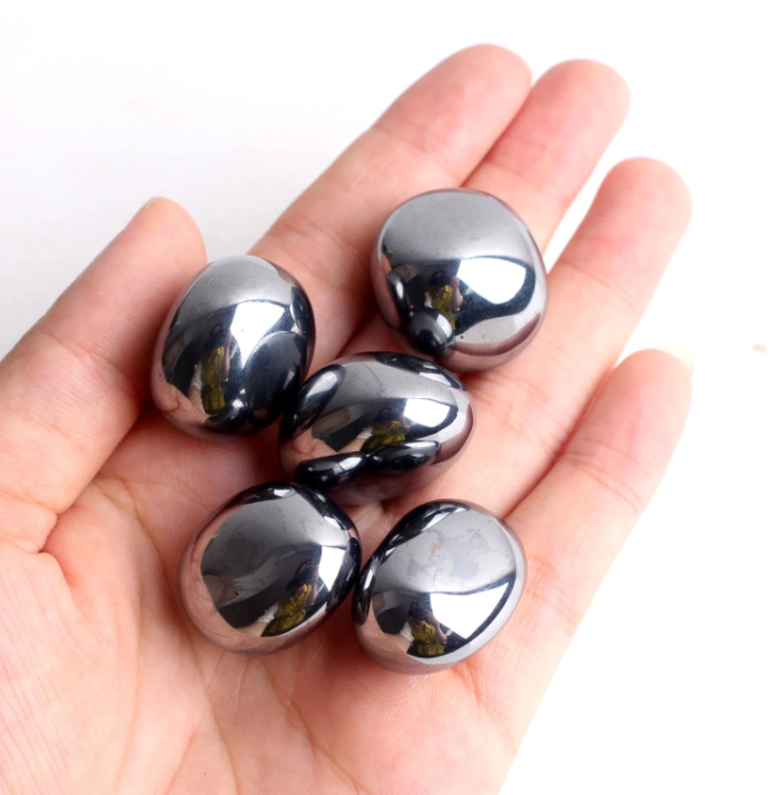 Terahertz stone facial massage tool on dark background