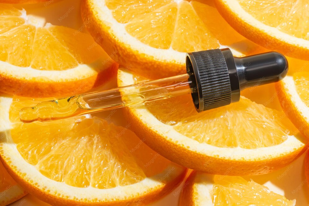 Vitamin C serum dropper bottle on marble surface