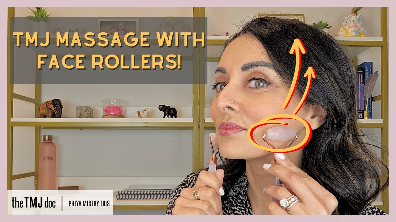 Jade roller applied to masseter muscle along the jaw for TMJ relief