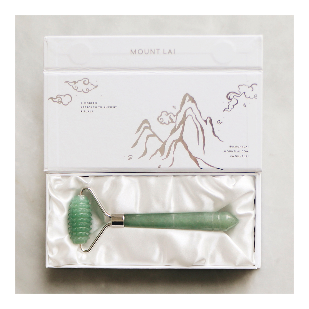 Sephora display with jade rollers in white packaging