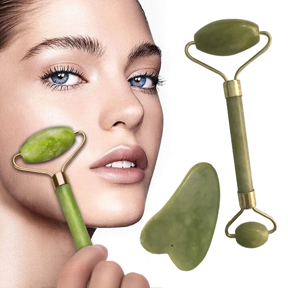 facial massage roller on cheek