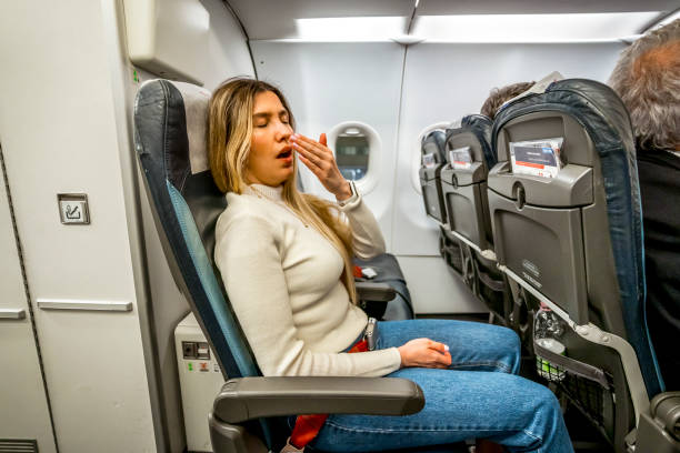 woman rolling face on plane