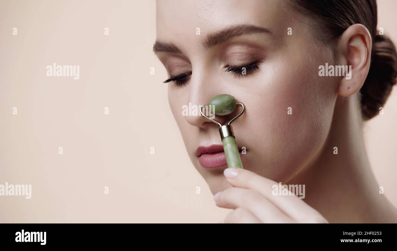 jade roller on nose bridge
