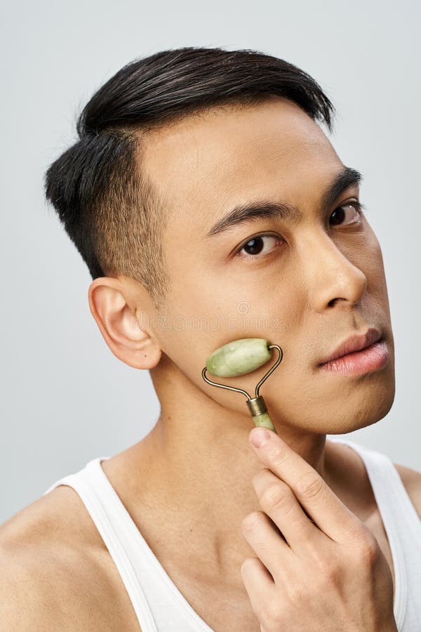 man using jade roller